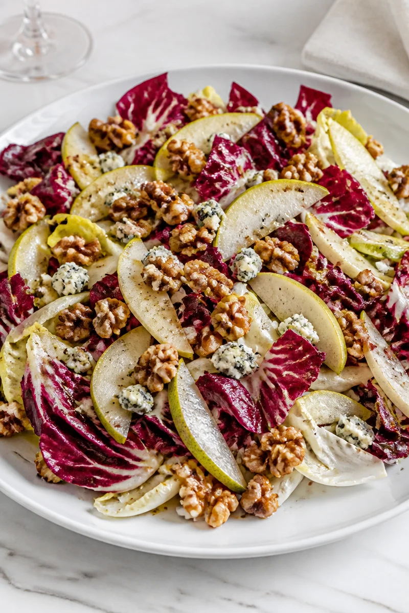 Roasted chicory walnut blue cheese salad with vibrant colors and fresh ingredients.